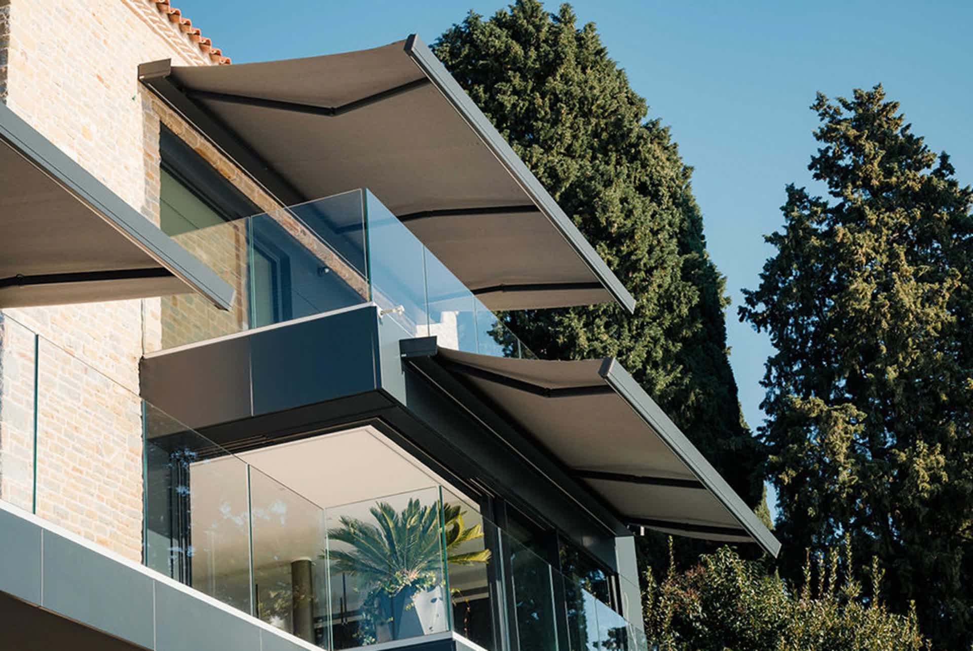 Folding-arm awning extended over a home terrace